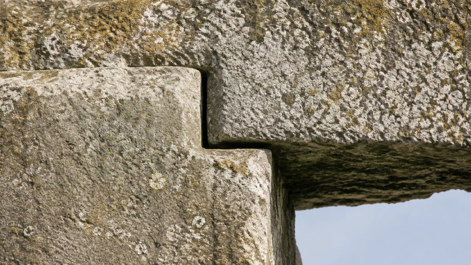 Close-up of a stone mortise and tenon joint at Stonehenge where a lintel rests locked onto an upright stone