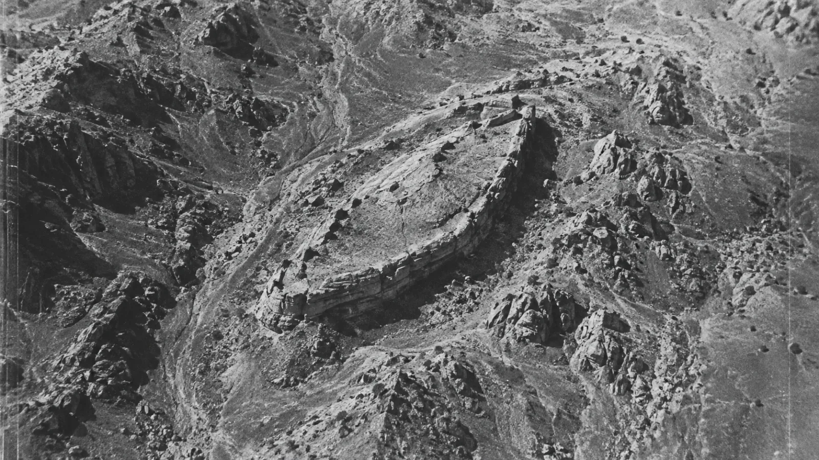Vintage-style aerial recreation of the boat-shaped rock formation as first photographed in 1959
